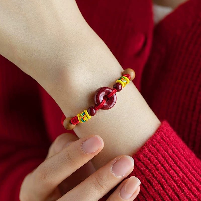 Red String Peach Wood Peace Bracelet